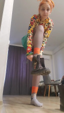 Witchoftheeast - Witch in a short leather skirt putting on her boots